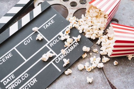 cinema-clapperboard-with-popcorn-box