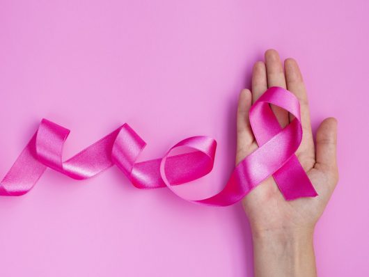 close-up-pink-ribbon-hand