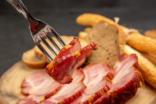 front-view-fresh-sliced-ham-with-bread-slices-buns-dark-meat-color-snack-meal-food-pig