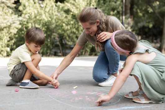 full-shot-kids-teacher-drawing-ground