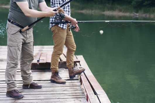 unrecognizable-men-with-fishing-rod-fishing